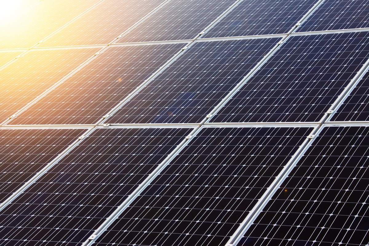 Aerial view of solar panel installation on large residential property